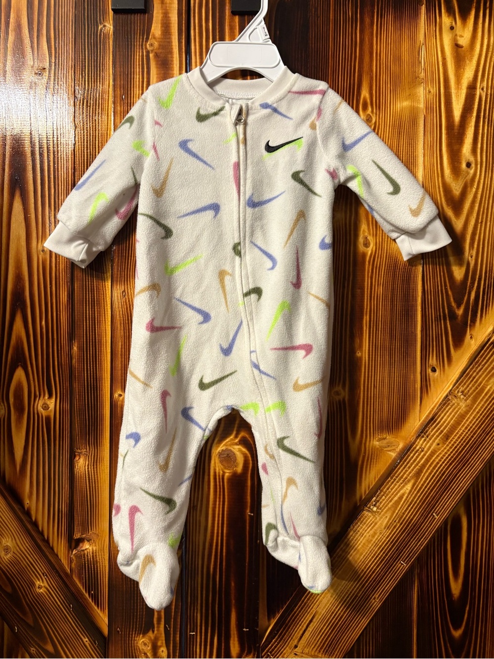 Nike White Fleece Baby Footed Romper with Multicolor Swooshes. Size 6 month